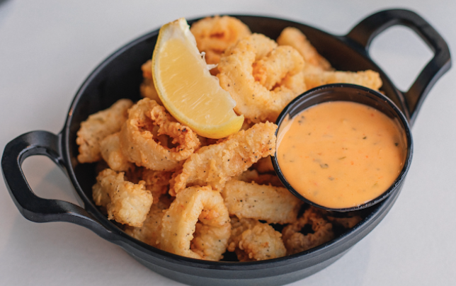 The Hangout signature dishes Popcorn ShrimpChicken Tender PlatterShrimp Po'Boy